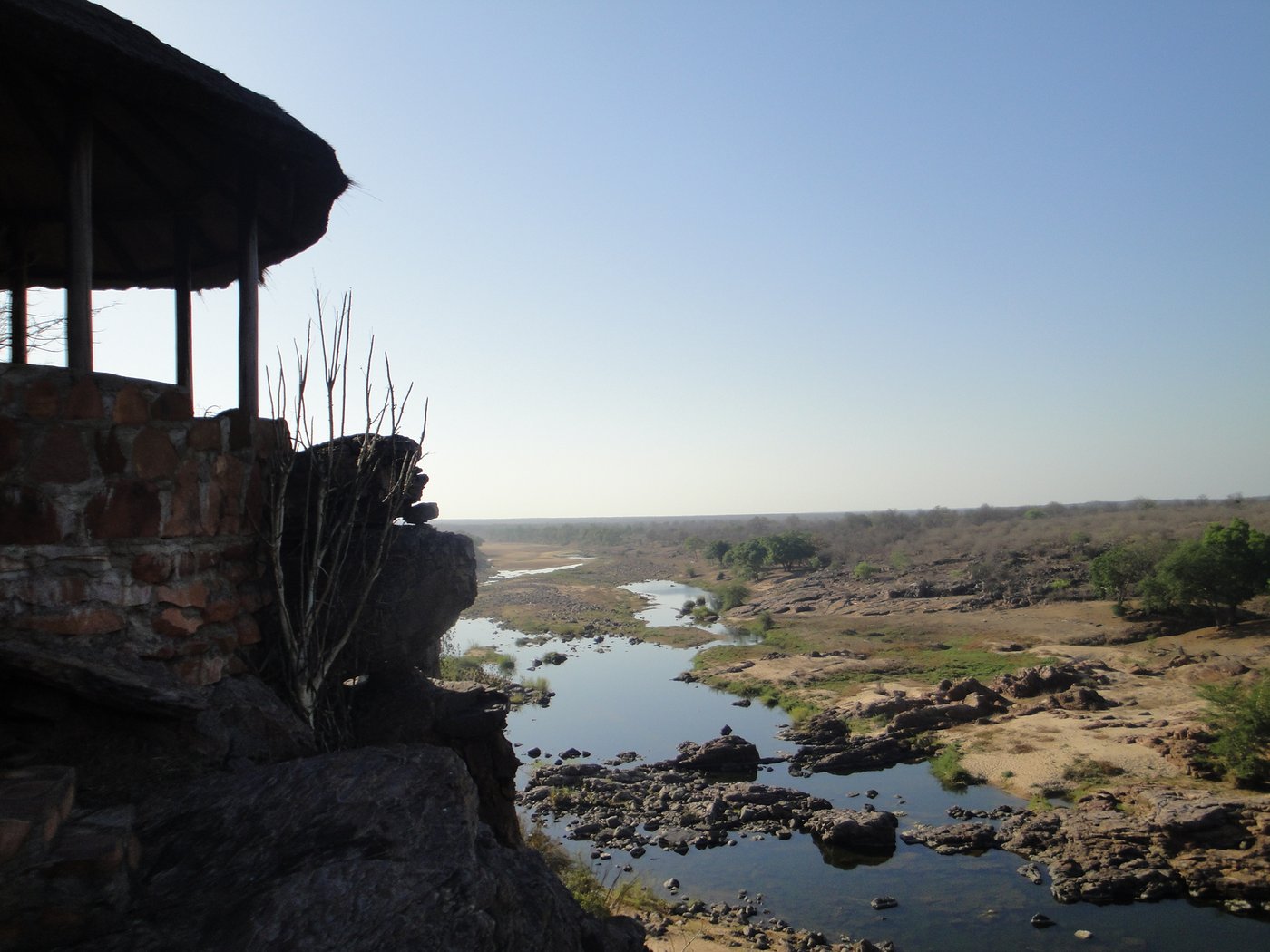 A rocky pool and hide on the Mwenezi River near Mabalauta, in the park's southern section